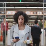 Woman walking out of Amazon Go Store