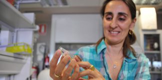 CSIC researcher Federica Bertocchini with a specimen of a wax worm