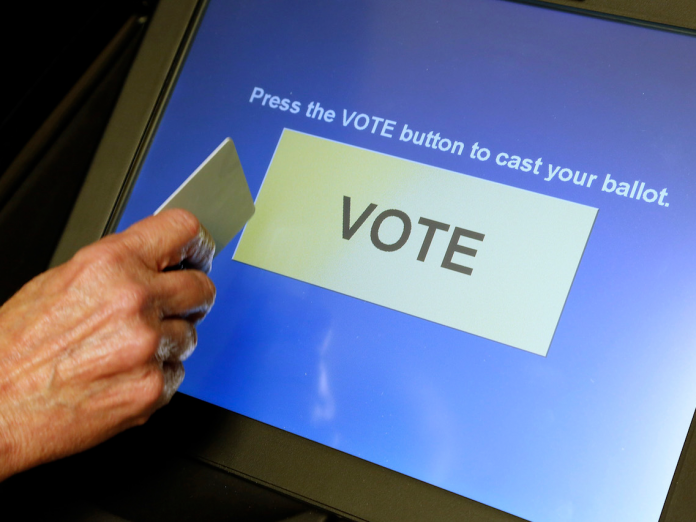 DRE voting machine at the final vote button
